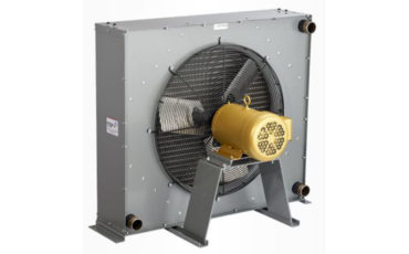 A fan is attached to the side of an industrial machine.